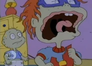 Chuckie rips his record sleeve and screams