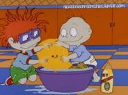 Tommy and Chuckie wash Henry with mustard