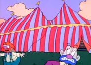 The clowns run away as the circus tent comes crashing down