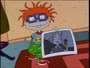 The famous image of Chuckie showing Chaz the photo.