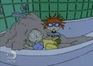 Chas screams when he sees his bathtub filled with sand