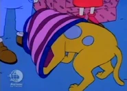 Spike angrily takes off the sweater