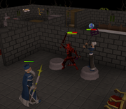 Standing in between the two plinths or between the statue and the wall like in this picture is a good strategy to keep from being pushed back. She can then be attacked with any melee weapon.