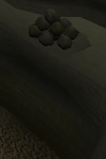 There is a very suspicious pile of rocks up there...