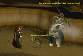 A shaman threatens a skavid.