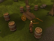Brother Cedric's broken cart, surrounded by barrels