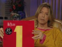 David Bowie Holds 1 2