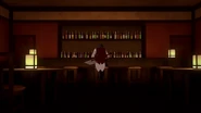 Qrow sitting at a bar