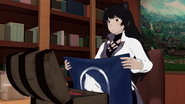 Blake holding the symbol of the peaceful White Fang