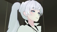 Weiss practices her smile while riding the elevator.