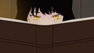 Blake peeks up from her book
