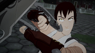 Tyrian blocks Qrow's attacks.