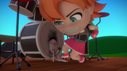 Nora kicks her drum