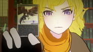 Yang holding a Giant Nevermore card