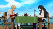 Blake and Sun take a break at a seaside drink bar.