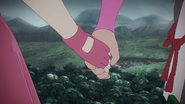 Ren holds Nora's hand.