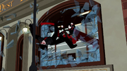 Ruby kicking the henchman through the window