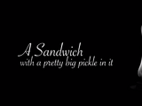 A Sandwich With A Pretty Big Pickle In It