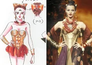 Calaveras, wears a golden corset with armor and a red bow. Her image was inspired by the Fall/Winter 1992 collection by Christian Lacroix