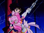 Chibi Moon stopping Saturn from using Silence Glaive Surprise.