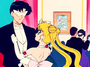 Tuxedo Mask dancing with Usagi.