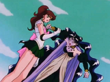 Jupiter grabs Nehellenia's arm to stop her to hurt Usagi