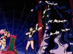 Queen Nehelenia faces off against Super Sailor Chibi Moon and Super Sailor Saturn alone