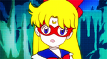 Sailor V, in her game, talking to Usagi