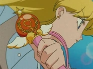 Venus holding her Crystal Change Rod.