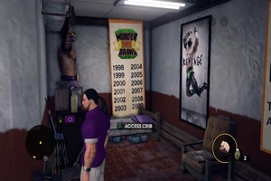 Back room with cot for sleeping, vandalized posters, and Angel statue
