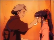 Sakura has her face cleaned by the woman who allowed her into her house.