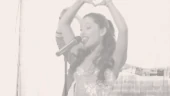 Ariana sings "Put Your Hearts Up"