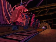 [2] Another tunnel of the ride, with the large cockroach at the end of it.