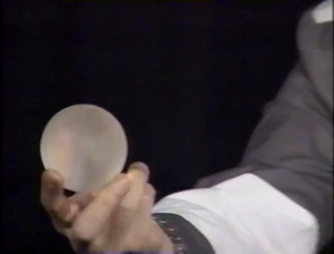 A sphere of Lamp Grasper being held by  in  as a reference