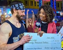 Roo receives the check from the creators of The Secret Life of Pets 2, worth $20,000.