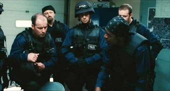 Rigg instructs his men