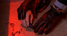 Hoffman leaves Strahm's fingerprints in the lab