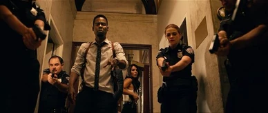 Morgey aims his weapon at the box