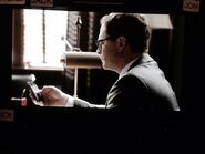 Joshua Malina on set in David's office filming.