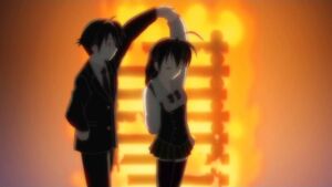 Makoto and Sekai dancing at the bonfire