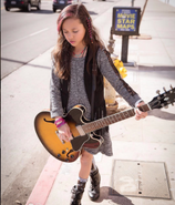 Bre with her guitar