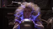 Summer being electrocuted after touching a Van de Graaff generator.