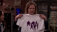 Mr. Finn showing the Kale's silhouette shirts.