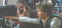 Chewie and Han in the cockpit of the Millenium Falcon.