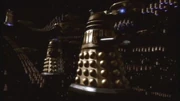 Daleks fly through space.