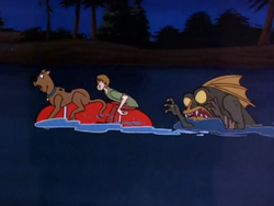 Shag and Scoob chased by the Beast of Bottomless Lake.png