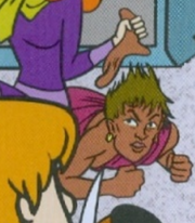 Brown-haired woman unmasked