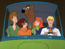 Scooby wearing magnifying glasses