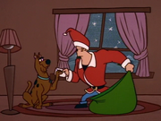 Santa JB gives Scoob his present