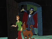 Night Ghoul behind Shaggy and Scooby.png